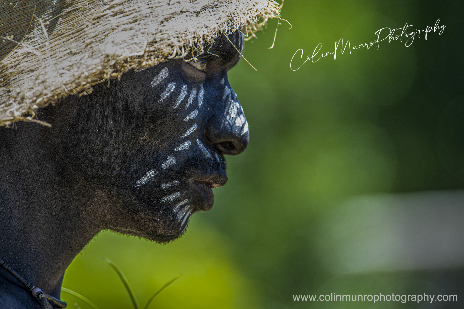 A warrior stares intently. Tufi, Papua New Guinea. @ Colin Munro Photography